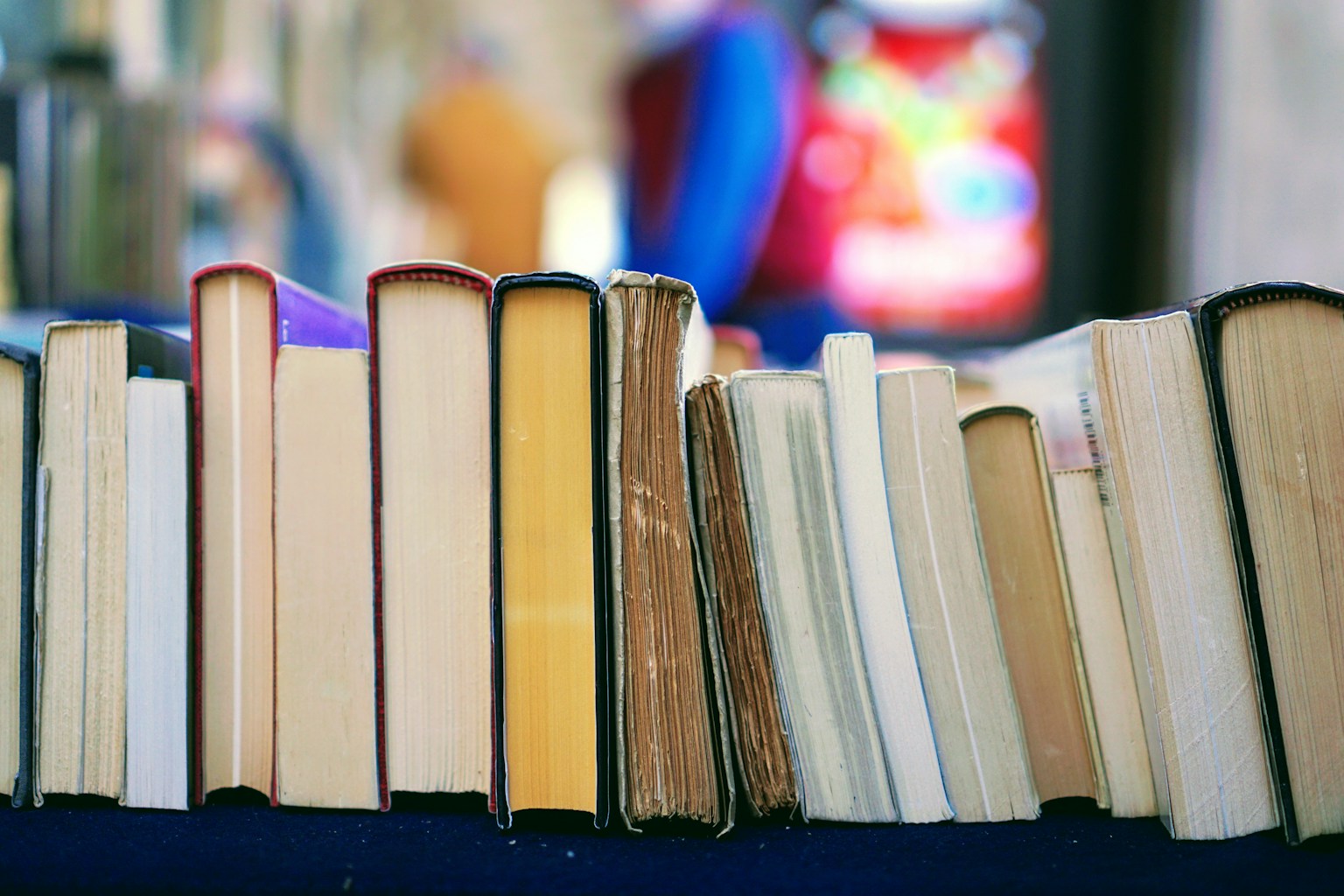 Stack of well-used books on a desk, ready for close reading